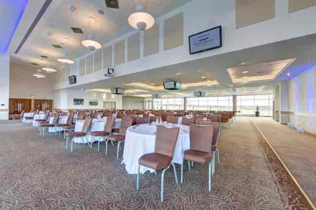 Diomed Suite at Epsom Downs: elegant venue for conferences and banquets with round tables.