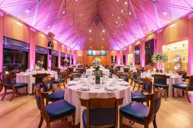 Elegant banquet hall with round tables, ideal for weddings and corporate events.