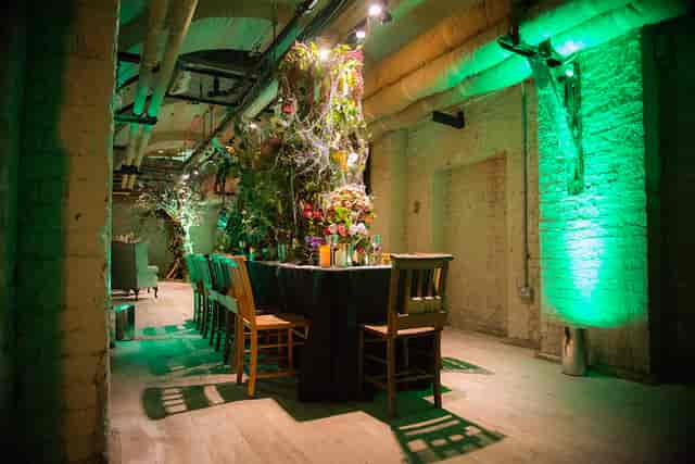Lightwells and Deadhouse at Somerset House, intimate event space with green lighting.