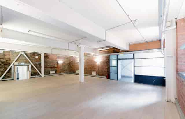 Versatile event space with exposed brick in The Vinyl Factory Soho for meetings and workshops.