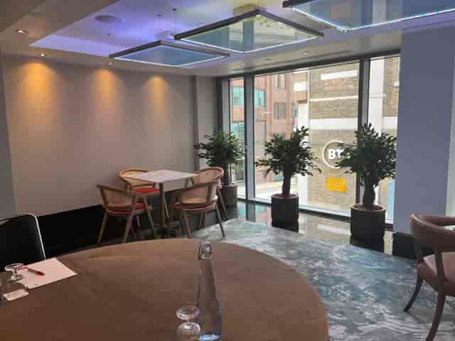 Executive Boardroom at Leonardo Royal Hotel, modern space with large windows for meetings.