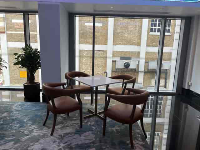 Executive Boardroom at Leonardo Royal Hotel, modern space with natural light for meetings.