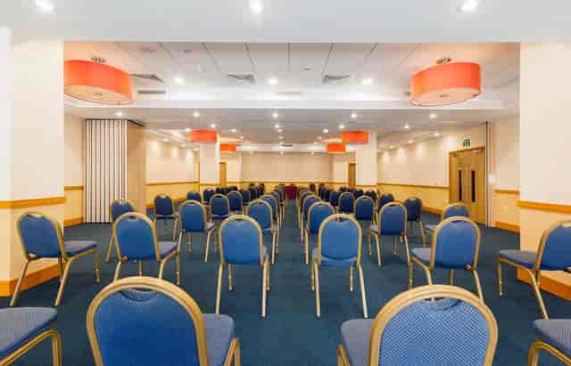 Domatic Suite conference room, theater-style seating, event venue, plenary session.