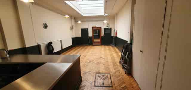 Versatile event space in Unity Islington with natural light, ideal for workshops and gatherings.