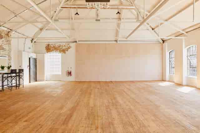Industrial studio space with hardwood floors for product launches and brand events.