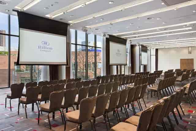 Grace Suite conference room at Hilton Liverpool, featuring dual screens for corporate events.