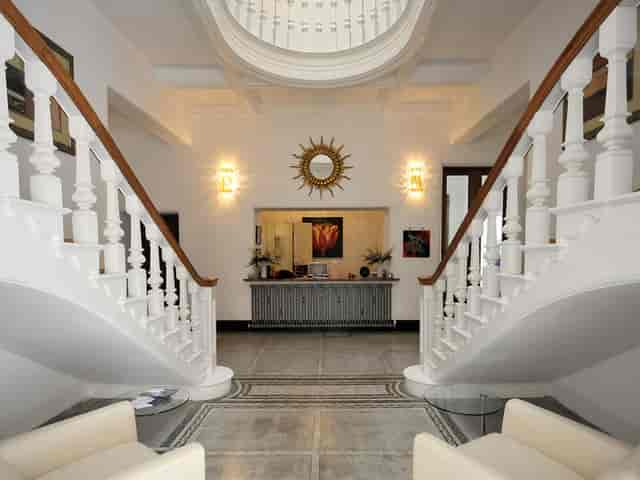 Elegant foyer with grand staircase at Leverhulme Hotel for events and meetings.