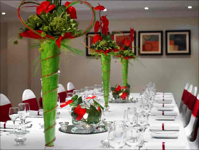 Elegant banquet table with floral centerpieces at Leeds Marriott Hotel for formal events.