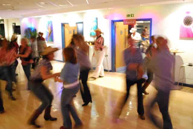 Lively Blue Cafe Bar event with colorful lighting, perfect for themed parties and networking.