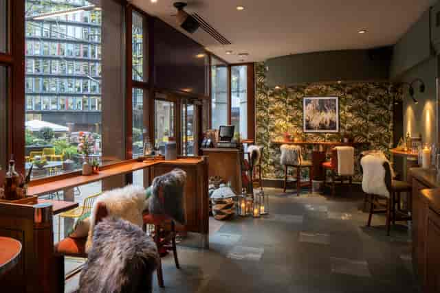 Stylish venue with cozy seating, perfect for meetings and networking events.