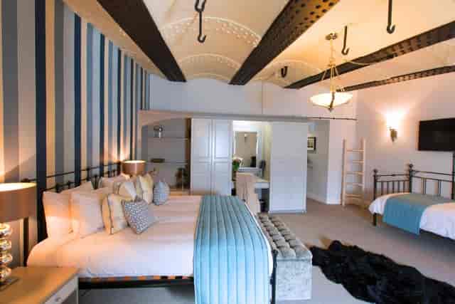 Central Atrium in No Man's Fort, spacious hotel room for VIP events and relaxation.