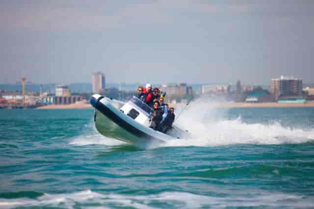 Team-building speedboat ride in Central Atrium, No Man's Fort - corporate retreat adventure.