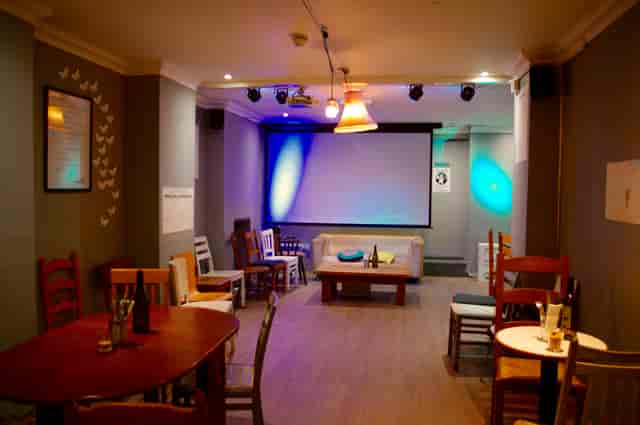 Versatile event space with ambient lighting for intimate gatherings and workshops.