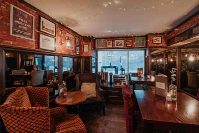 Cozy venue with warm lighting, ideal for intimate gatherings and small events.