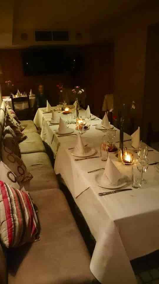 Elegant dining table in Retsina Private Room for formal dinners and intimate gatherings.