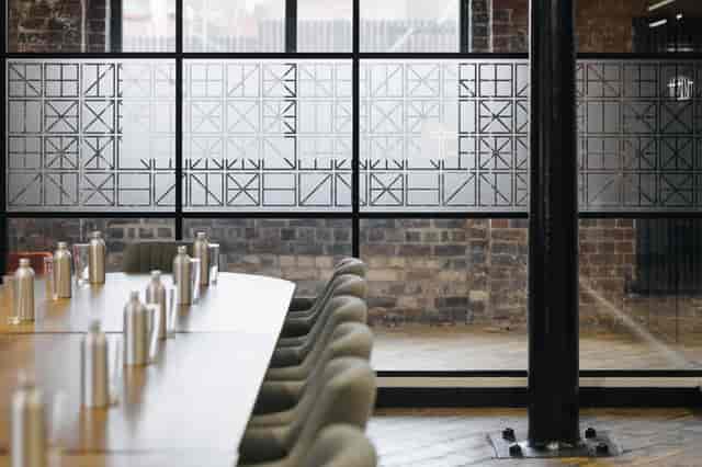 Grand Union Boardroom with long wooden table, ideal for modern meetings and events.