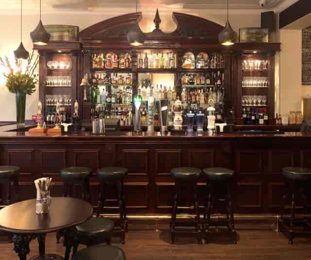 Elegant bar area at The Hat & Tun, perfect for networking events and cocktail receptions.