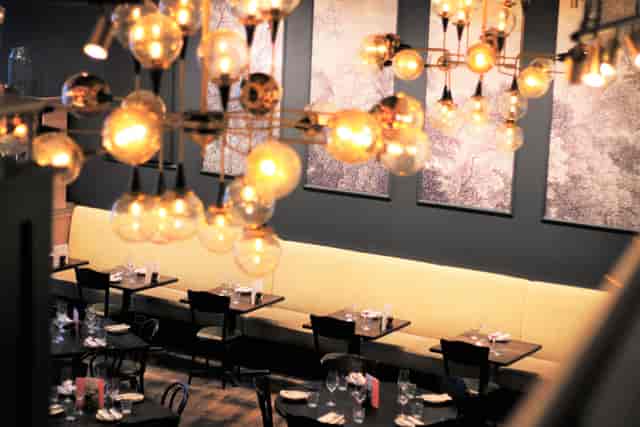 Semi-private Mezzanine at Brasserie Blanc, elegant dining for corporate events and gatherings.