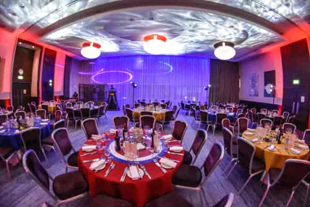 Tower Suite banquet setup at Hilton London Tower Bridge with colorful tables for events.