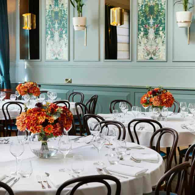 Elegant dining space at Barrister Court, featuring floral centerpieces for formal events.
