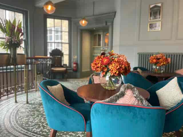 Stylish Judge's Chambers with plush teal seating, ideal for networking events.