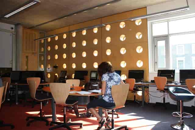 Modern training room with circular cutouts, perfect for workshops and meetings.
