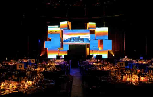 Sophisticated event setup in Roundhouse with elegant tables for a gala or awards ceremony.