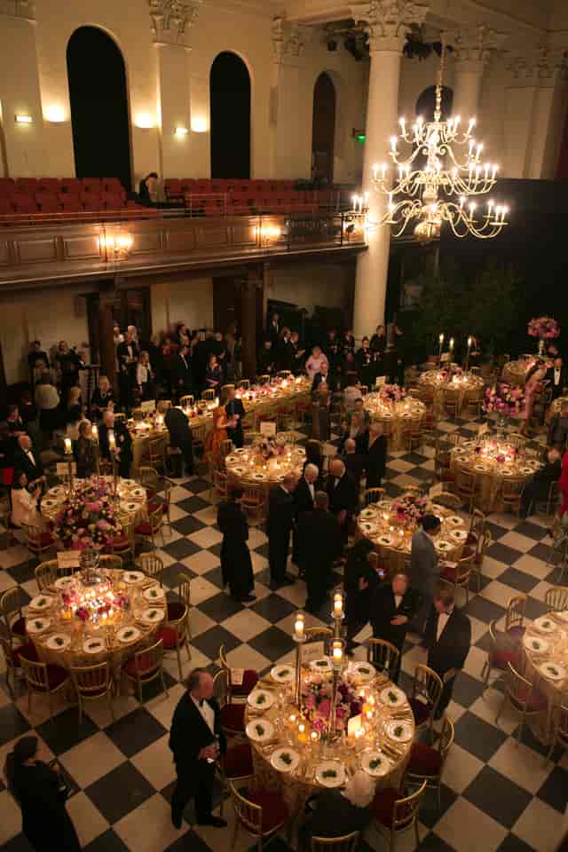 Gala event in Main Hall, Sinfonia Smith Square with elegant floral centerpieces.