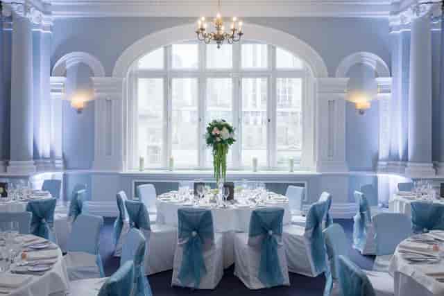 Elegant Fenchurch Suite banquet room with floral centerpiece for weddings and corporate events.