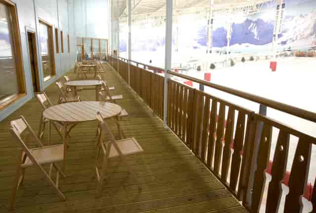Après Lodge balcony overlooking indoor ice rink, ideal for networking events and gatherings.