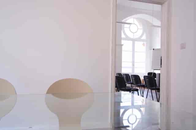 Waterloo Room at Southbank Training: sleek meeting space with glass table, ideal for workshops.