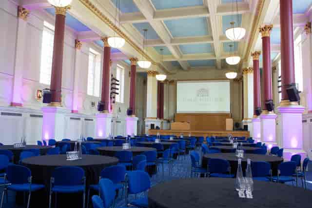 BMA House Great Hall: Blue chairs, purple lights, corporate event, gala dinner.