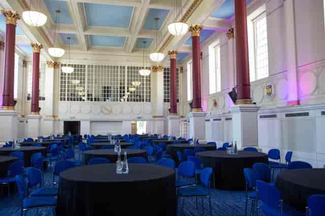 Great Hall in BMA House: elegant event venue with round tables, ideal for conferences.