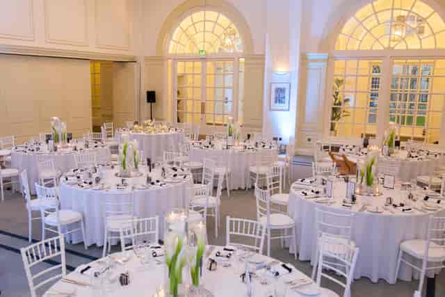 Elegant Snow Room event space with round tables, ideal for formal gatherings.