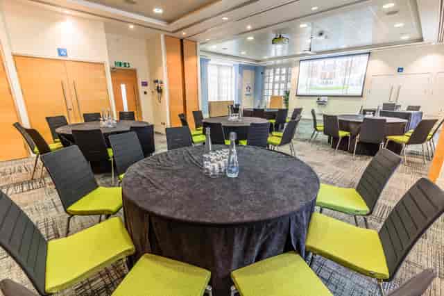 Murrell Room in BMA House: professional meeting space with round tables for workshops.
