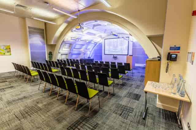 Black Room in BMA House, modern curved design for corporate meetings and workshops.