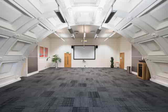 Spacious Harvey room at BMA House with arched ceiling, ideal for meetings and workshops.