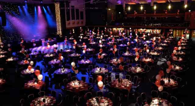 Elegant event space at Cheltenham Racecourse with red and white balloons for galas.