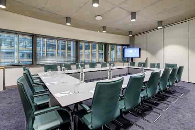 Modern boardroom at Wembley with large table, ideal for corporate meetings and workshops.
