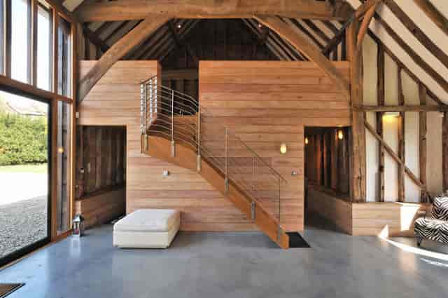Modern rustic barn venue with high ceilings, ideal for events and gatherings.