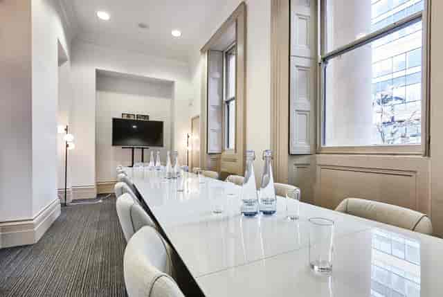 Modern meeting room in Manchester Art Gallery, featuring a long table for professional events.