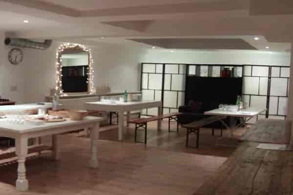 Versatile event space in White Hart Wine Room, ideal for dining and networking.