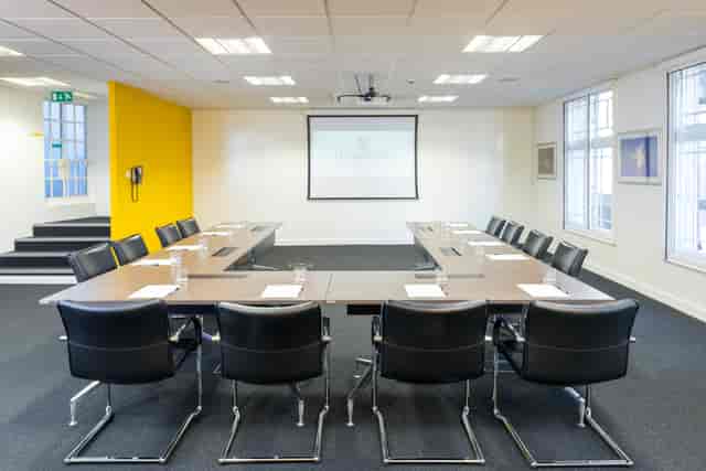 Boardroom at Dominion Theatre with central table, ideal for corporate meetings and workshops.