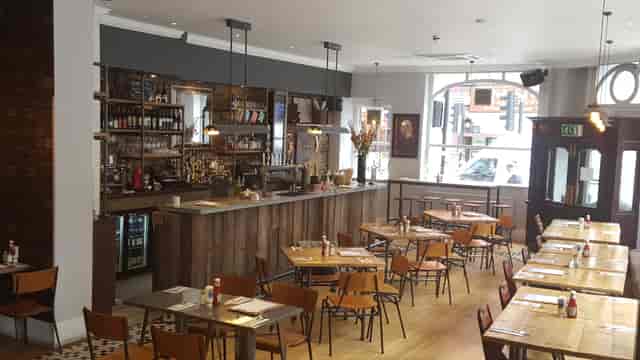 Main Bar at The Yorkshire Grey: modern event space with ample seating for gatherings.