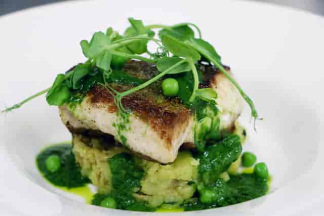 Elegant fish dish with creamy mashed potatoes for upscale dining events.