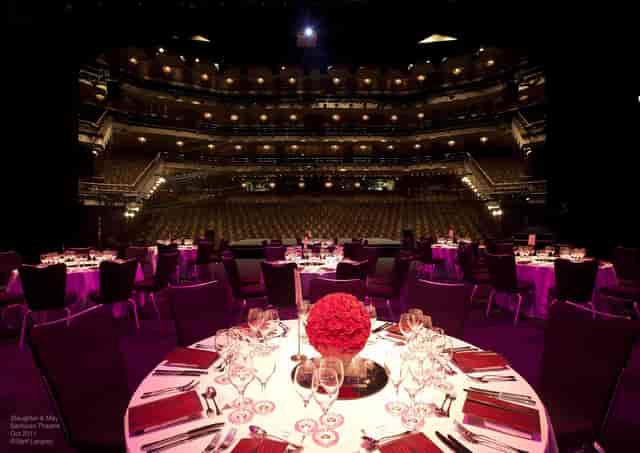 Barbican Theatre banquet setup with floral centerpieces for upscale events and galas.