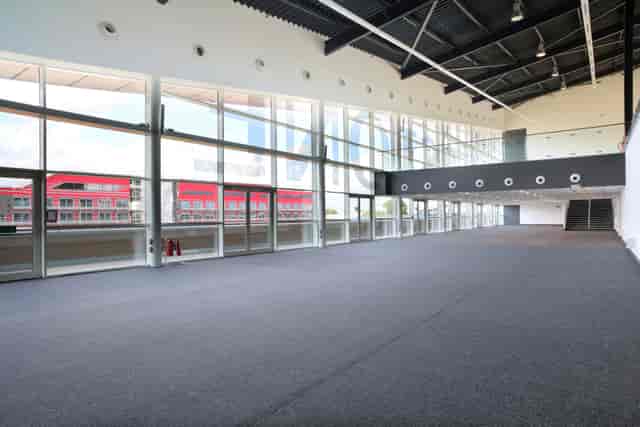 Spacious Hall 4 at Silverstone for conferences and exhibitions with natural light.