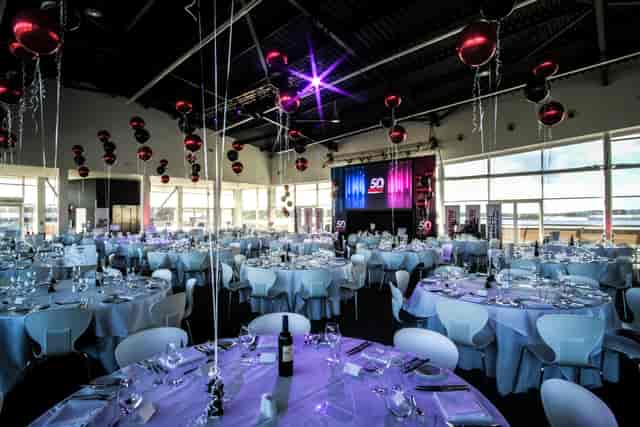 Elegant event space in Silverstone with round tables, ideal for galas and corporate events.
