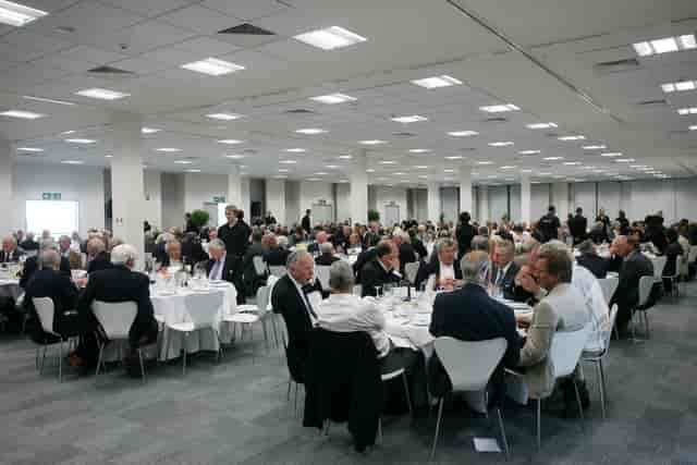 International Media Centre banquet setup for corporate events with elegant attendees.