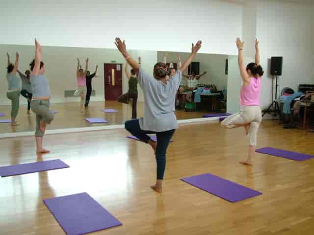 Yoga session in Oxford House dance studio promoting wellness and mindfulness at events.